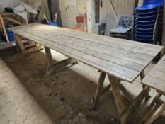 A long pine toped trestle table having three supports, 360 x 86cm.