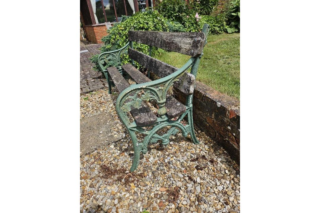 A garden bench with cast iron ends, approx 152cm wide. - Image 2 of 3