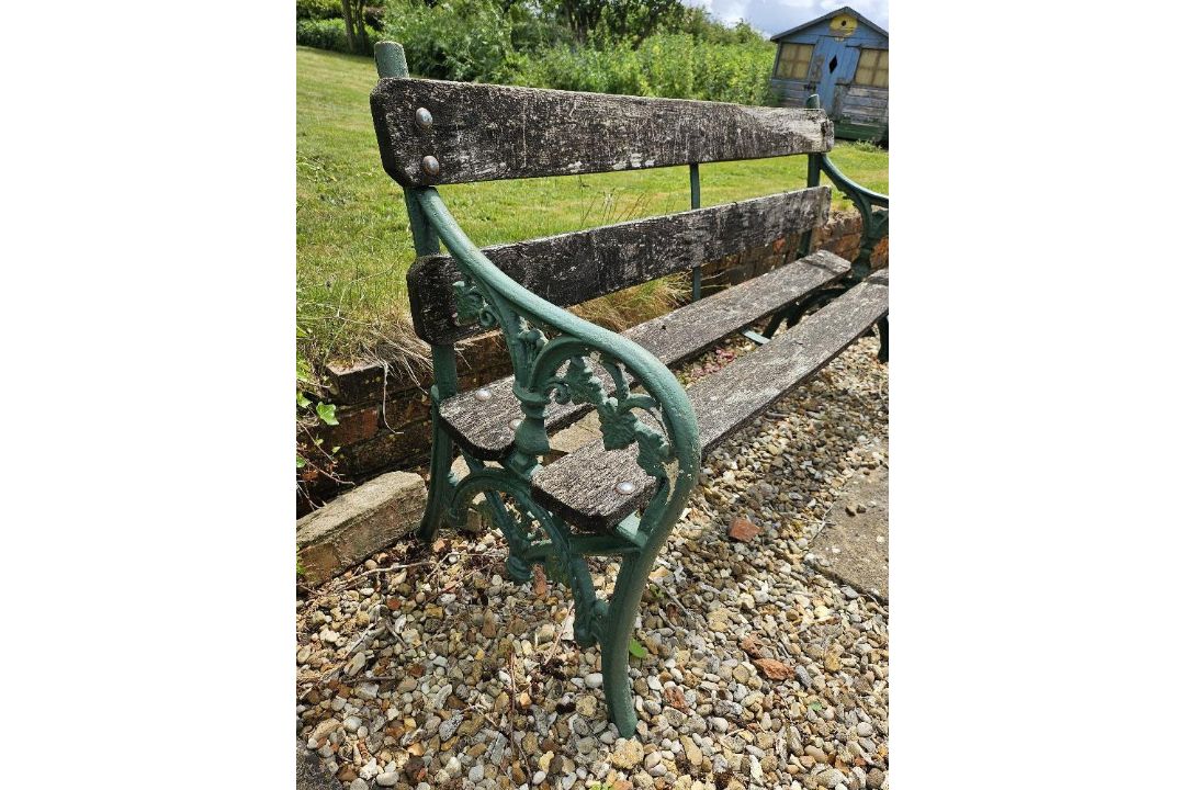 A garden bench with cast iron ends, approx 152cm wide. - Image 3 of 3