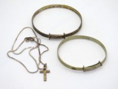 Two silver christening bangles and a silver cross on chain.