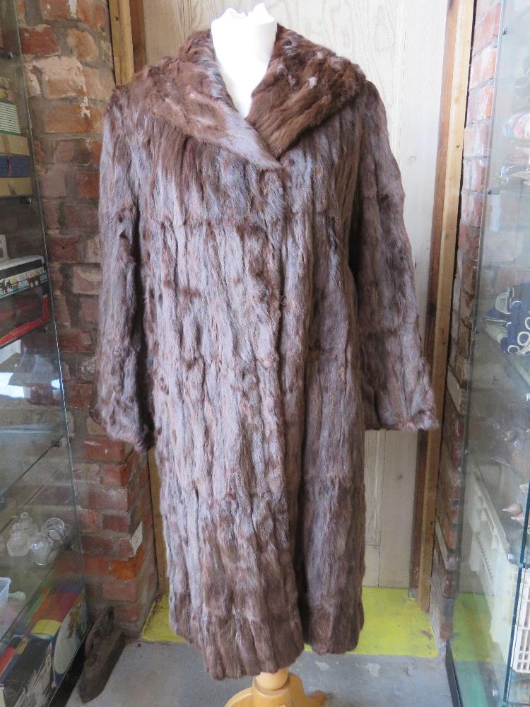 A ladies vintage fur coat.