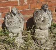 A pair of cast eagle garden statues.