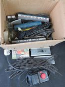 A quantity of assorted model railway track, carriages, etc.