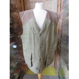 A Bronte Classic Countrywear tweed gillet size XL, 50% wool.