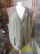 A Bronte Classic Countrywear tweed gillet size XL, 50% wool.