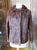 A ladies vintage fur coat.