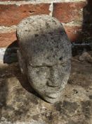 A carved stone head.