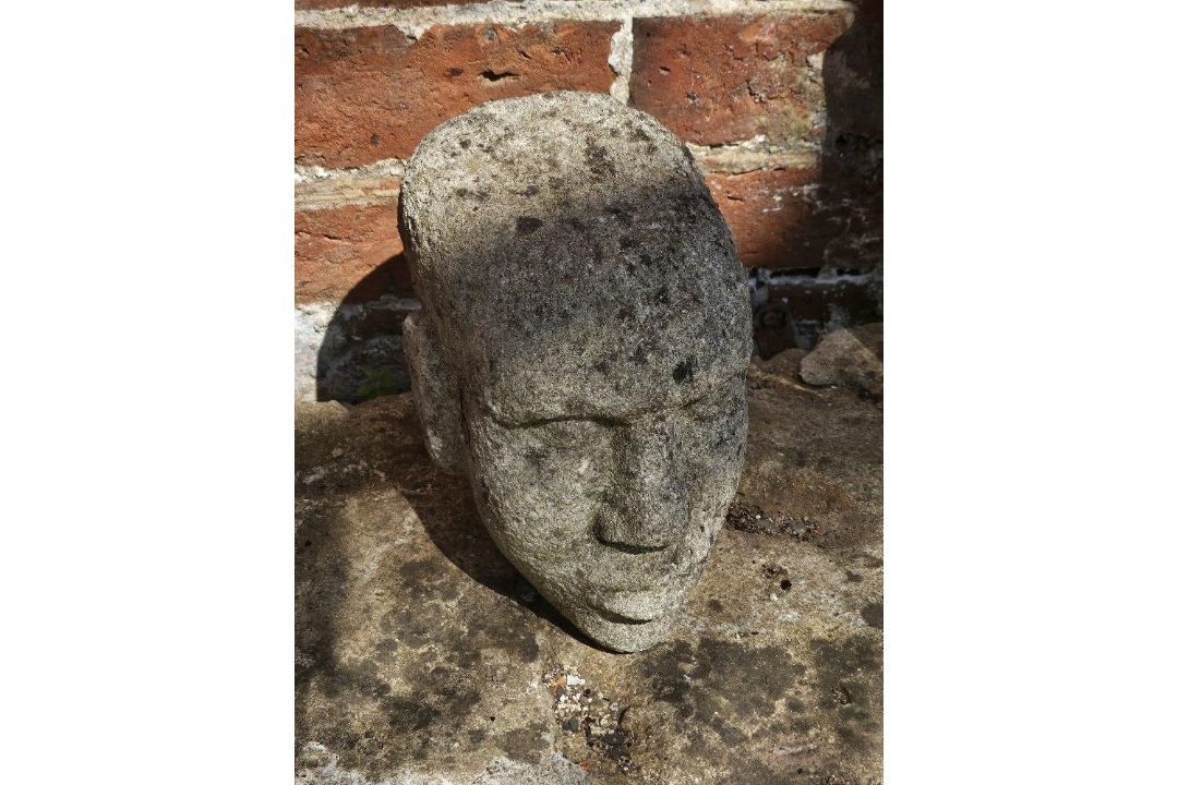 A carved stone head.