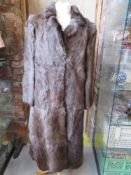 A ladies vintage fur coat.