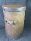 A contemporary leather laundry basket.