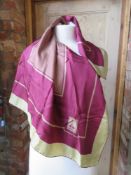 A Burberry 100% silk scarf.