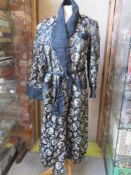 A vintage dressing gown with Chinese Dragon design.