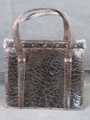 A vintage crocodile leather handbag.