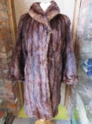A ladies vintage fur coat.