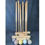 A set of six croquet mallets and balls, mallets marked for Jaques London.