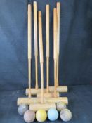 A set of six croquet mallets and balls, mallets marked for Jaques London.