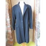 An 80% wool, 10% cashmere black evening coat by Thomas Nash, size M.