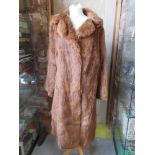 A ladies vintage fur coat.