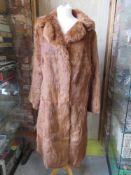 A ladies vintage fur coat.