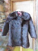 A vintage fur coat, small size possible childs/teen, Russian? labels.