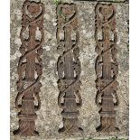 A set of three cast iron balustrades or decorative panels.