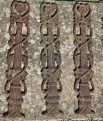 A set of three cast iron balustrades or decorative panels.