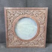 A Black Forest type carved wooden frame, having oak leaf design,