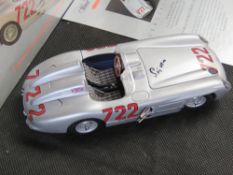 Signed by Sir Stirling Moss;