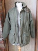 A 70% wool tweed jacket by Woodstock,