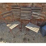 A set of six wood and metal bistro chairs.