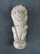 A carved hilt or handle from a Malay Keris knife or Kris knife,
