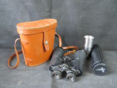 A pair of binoculars and a set of tot cups in case.