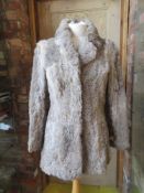 A ladies vintage fur coat.
