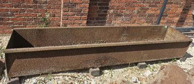 An very large steel trough - slit cut to base for drainage for current use as a garden planter,
