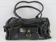 Tommy & Kate; a black leather handbag.