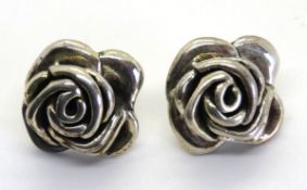 A pair of 925 silver rose stud earrings.