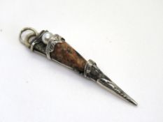 A Scottish hardstone pendant, naive repair, Dirk style.