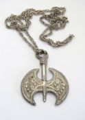 A white metal axe pendant on silver chain.