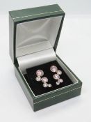 A pair of silver pink stone bubble earrings in presentation box.