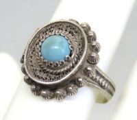 A filigree poison / snuff concealed compartment ring having blue stone upon, handmade.
