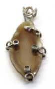A large hardstone pendant set in silver, stamped 925.