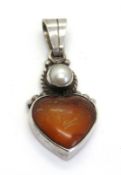 A silver heart shaped pendant, stamped 925.