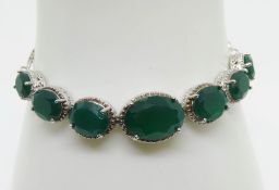 A silver bracelet to match previous lot.