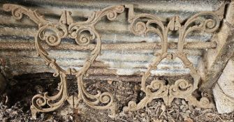 A pair of cast iron table ends.