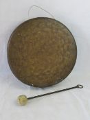 A large copper gong with beater, 14