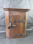 A small contemporary corner cupboard.