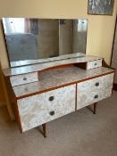 Mid century; A vintage 1960s marble effect Formica topped dressing table with matching wardrobe.