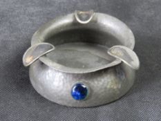 An early 20th century Civic Pewter cigar tray in the Arts and Crafts style set with three Ruskin