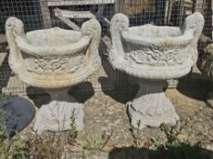 A pair of cast garden planters of urn form (each separate into two parts)