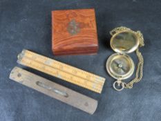 A quantity of collectables including brass compass, spirit level, rule and nautical themed box.